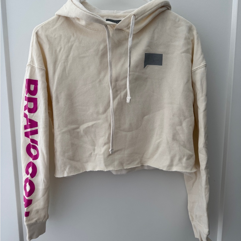 BravoCon Cream Cropped Hoodie with Pink Sleeve Print